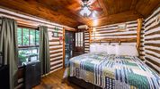 Cozy Cabin Bedroom at the Log Cabin Motor Court Cabin Rentals in NC