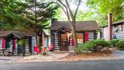 The Log Cabin Motor Court offers quaint lodges for rent in the mountains of NC.