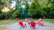 The Bonfire and Picnic Tables at the Log Cabin Motor Court offering historic vacation rental lodges in Asheville NC